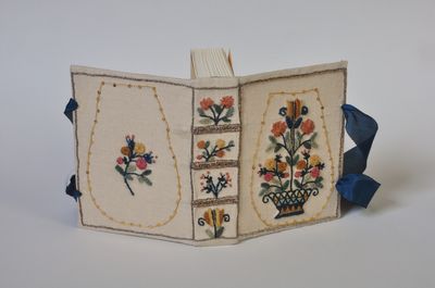 Embroidered book showing front and back covers